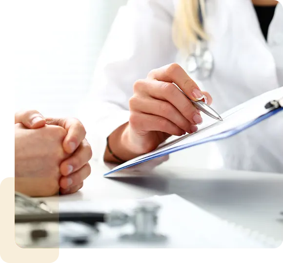 Female doctor hand hold silver pen filling patient history list at clipboard pad.